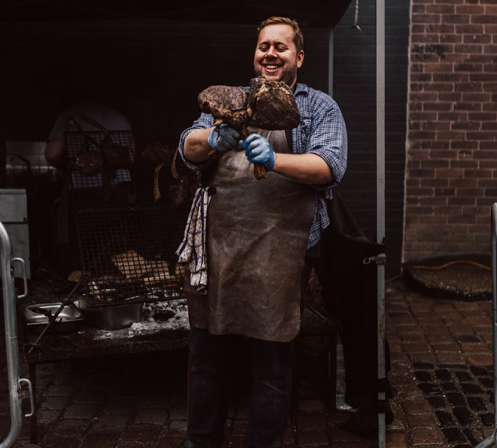 Broken bone bbq showing his signature tomahawk steaks