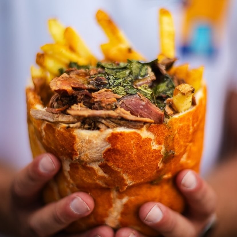 Growler loaf stuffed with meats, chips and gravy