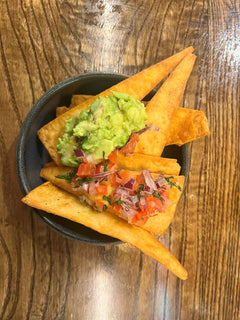The Hart crispy tortilla chips served with fresh guacamole and tomato salsa in Redditch