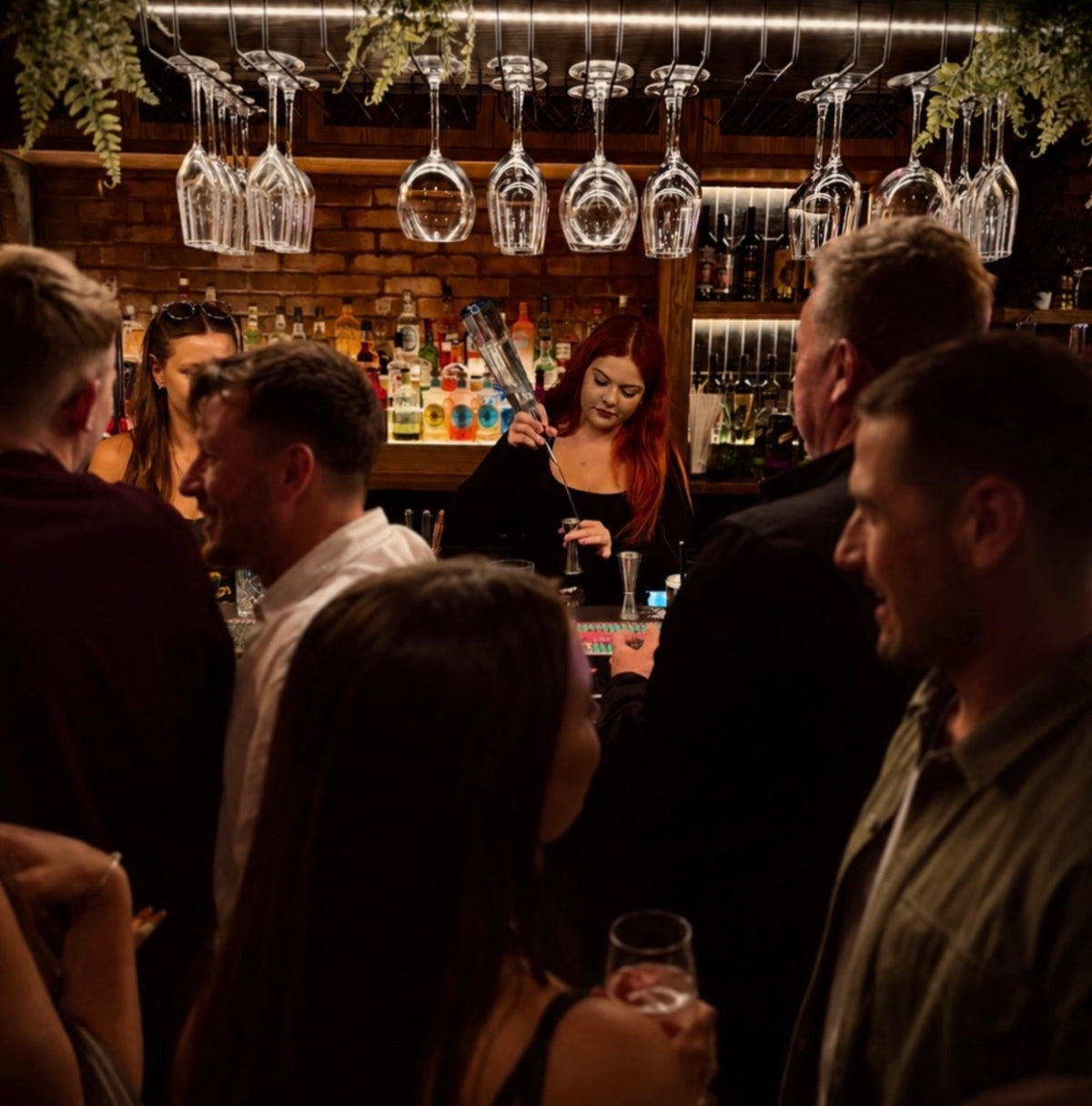 Bartender serving at The Hart at Headless Cross pub