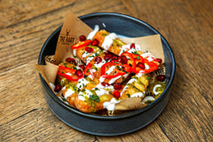 The Hart crispy halloumi sharing starter topped with creamy sauce, fresh chilli, herbs and pomegranate seeds in Redditch