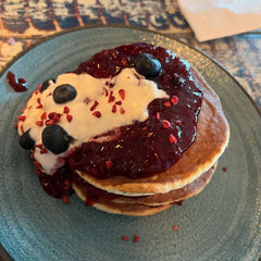 The Hart winter berry pancakes topped with berry compote, yoghurt and fresh blueberries in Redditch