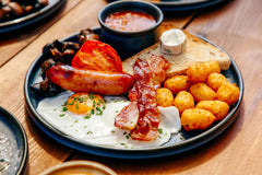 The Hart winter full English breakfast with sausage, bacon, fried egg, mushrooms, tomato and crispy potato tots in Redditch