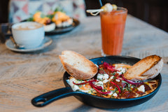 The Hart winter smoky shakshuka with feta, red onion and toasted sourdough, served with brunch drinks in Redditch