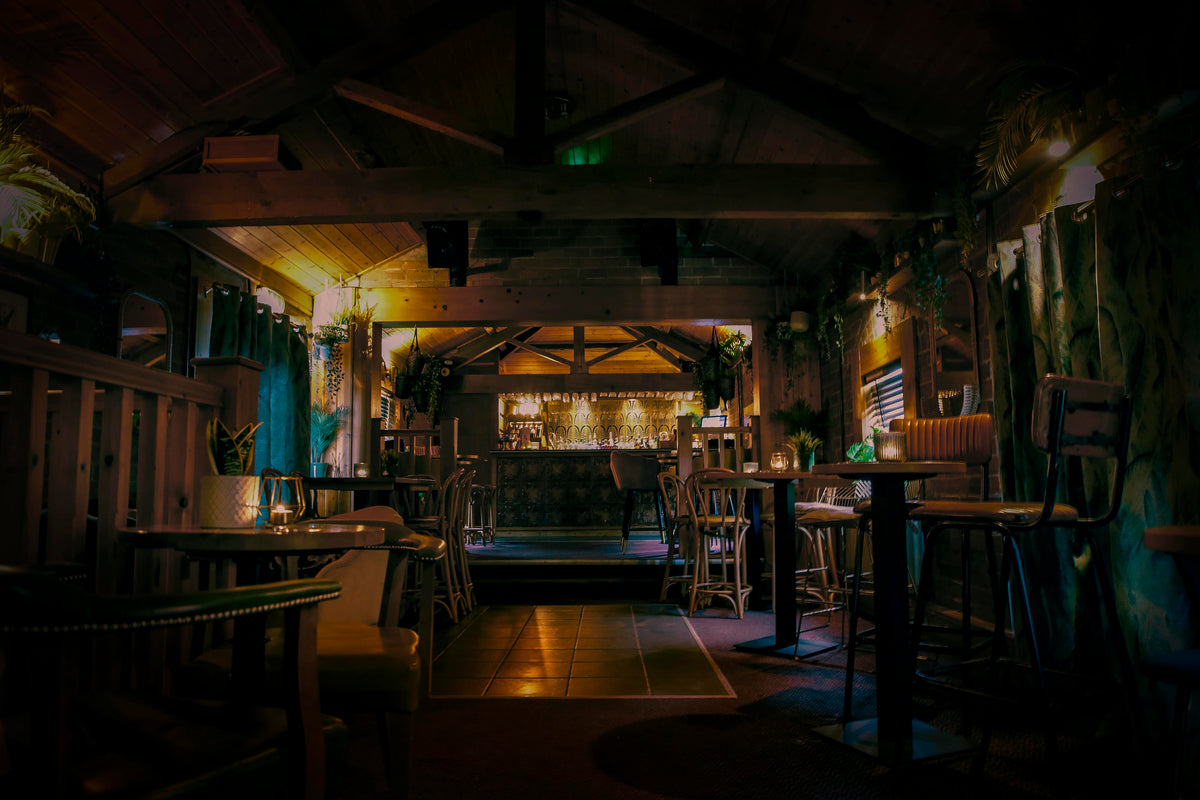 Whitetail Cocktail Bar at The Hart in Headless Cross, Redditch, a cosy private hire venue for bottomless brunch, events and parties with rustic timber beams, ambient lighting, a statement cocktail bar and relaxed seating for parties and celebrations.